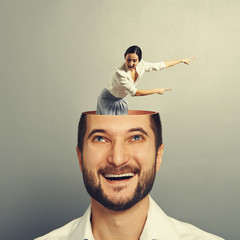 Poster - man looking up at pointing woman