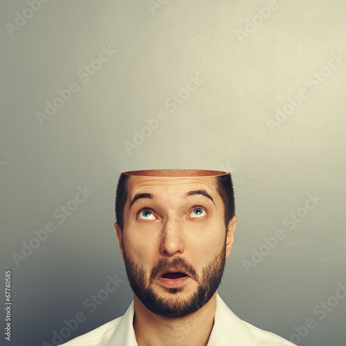 surprised man looking up at his open empty head Poster Mural XXL