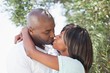 © WavebreakmediaMicro - Attractive couple embracing in their garden