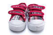 Red sneakers for a baby on white background