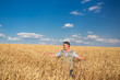© Ryzhkov Oleksandr - farmer standing in a wheat field