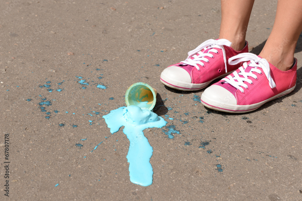 Ice cream fell on asphalt top view