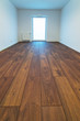 Empty apartment interior with wooden floor after renovation