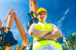 Asian construction worker in front of shovel excavator