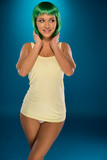 Fototapeta Młodzieżowe - Cute slender young woman with green hair