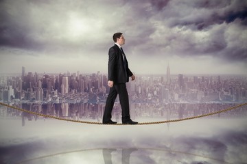 Aufkleber - Composite image of handsome businessman stepping on tightrope