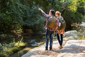 hikers standing at mountain valley