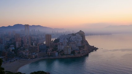 Wall Mural - A foggy sunrise over  Mediterranean resort Benidorm