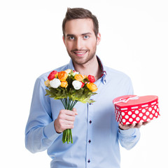 Wall Mural - Happy handsome man with flowers a gift.