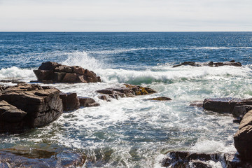 Canvas Print - Surf Hitting Rocks in Blue Water