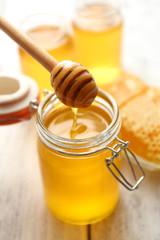 Poster - Fresh honey on wooden table