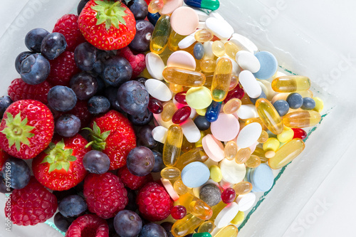 Fotografie, Obraz Healthy lifestyle, Fruit and pills, vitamin supplements