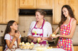 Happy family mother, daughter cooking food on kitchen