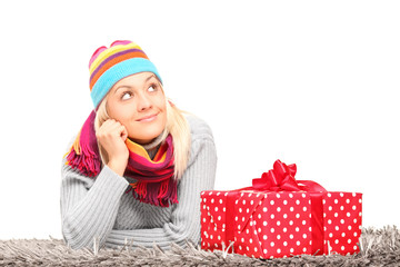 Sticker - Woman lying next to a Christmas present