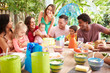 © Monkey Business - Group Of Families Celebrating Child's Birthday At Home