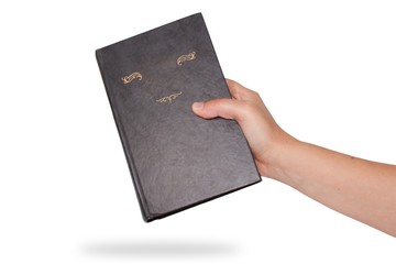 Woman's  hand picking blank red book on white background