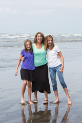 Wall Mural - Mother and daughters at beach