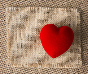 Wall Mural - Red heart on burlap, sackcloth background. Valentines Day