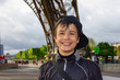 Cheerful teenager near the Eiffel Tower in Paris