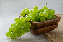 Bunch Of Grapes In A Wooden Bowl