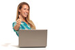 © Paul Collection - Happy  woman using laptop seated at the desk