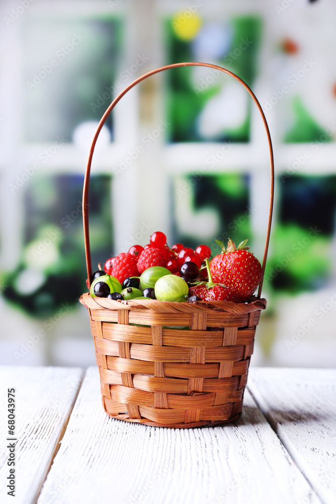 Forest berries in wicker basket,