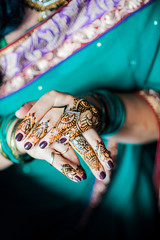 Wall Mural - Hands painted with henna close up