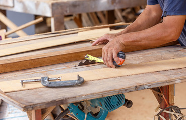 carpenter use saw cut wood formake new furniture