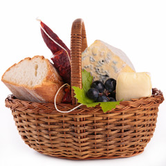 Wall Mural - wicker basket with bread,cheese and sausage