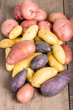Group of fingerling potatoes on wooden table