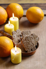 Sticker - Bowl of christmas cookies among aromatic oranges and yellow cand