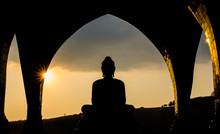 Silhouette Buddha In Sunset