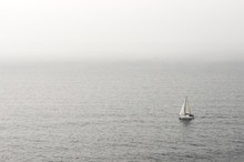 Lonely Sailboat On Water