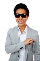 Sticker - Portrait of a smiling asian man over white background