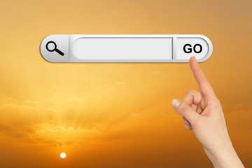 Human hand indicates the search bar in browser