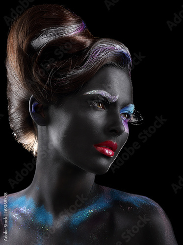 Fototapeta na wymiar Body-painting. Woman with Fantastic Stagy Makeup over Black