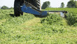 © oticki - Mowing clover field with rotary cutter