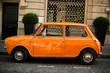 © Zarya Maxim - Retro car orange color purity in the street