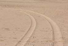 Tire Tracks In The Sand