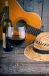 guitar and Wine on a wooden table
