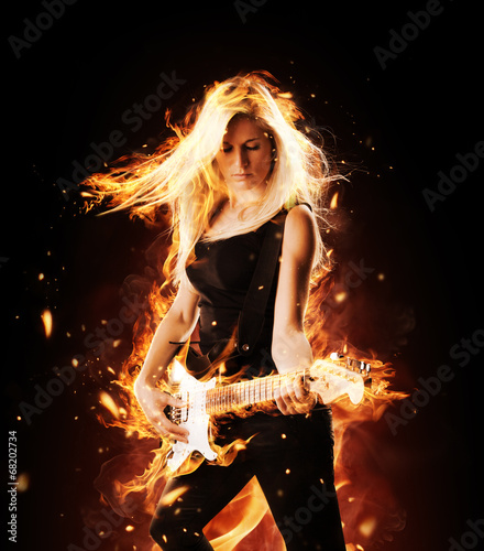 Tapeta ścienna na wymiar Burning girl with flaming guitar on black background