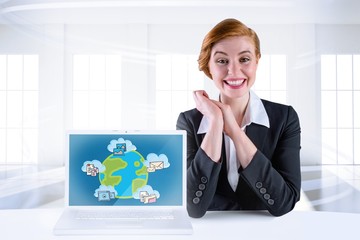 Poster - Composite image of excited redhead businesswoman sitting at desk