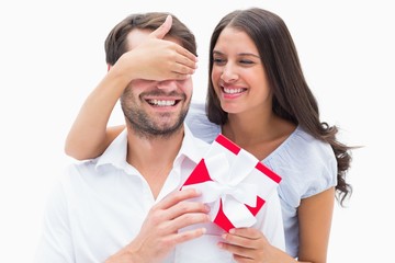 Poster - Pretty brunette surprising boyfriend with a gift