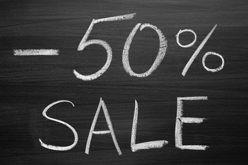 Wall Mural - 50-percent sale title written with a chalk on the blackboard