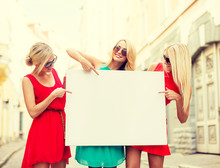 Three Happy Blonde Women With Blank White Board