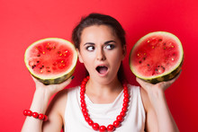 Beautiful Young Woman Holding Watermelon Against Red Background