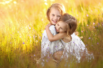 Wall Mural - Portrait of two girls in the woods girlfriends