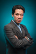 © DragonImages - Confident Vietnamese businessman