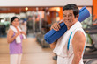 © DragonImages - Senior man with yoga mat