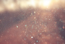 Abstract Photo Of Light Burst And Glitter Bokeh Lights. Image Is